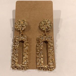 Gold colored diamond cut textured earrings